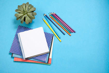 Assorted school supplie with a notebooks on blue backgroundの写真素材