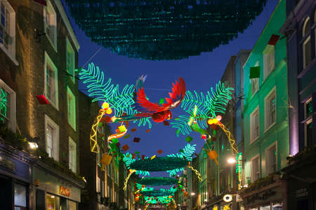 LONDON - DECEMBER 18, 2017: Christmas lights on Carnaby Street, London UK. Carnaby Christmas lights feature some of the most unusual decorations and lights in London.のeditorial素材