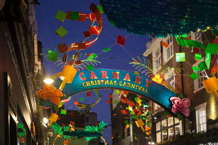 LONDON - DECEMBER 18, 2017: Christmas lights on Carnaby Street, London UK. Carnaby Christmas lights feature some of the most unusual decorations and lights in London.のeditorial素材