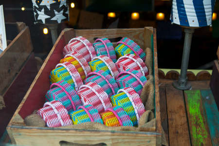 Woven multicolored boxes in a shop window of a Mexican storeの写真素材