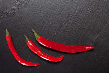 chilli pepper on black stone
