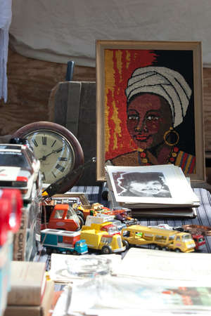 LONDON, UK - August 22, 2017: Embroidered portrait of a black woman, toy cars for sale at Old Spitalfields Market in London. market existed here for at least 350 yearsのeditorial素材
