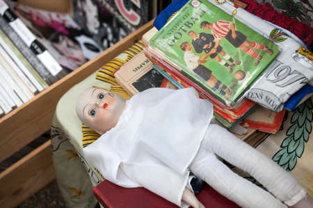 LONDON, UK - August 22, 2017: Old Pierrot next to magazines about football at Old Spitalfields Market in London. A market existed here for at least 350 yearsのeditorial素材