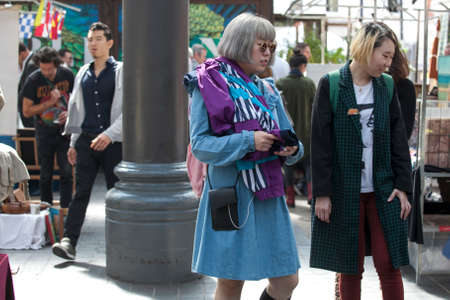 LONDON, UK - August 22, 2017: Old leather white shoes on a stepladder for sale at Old Spitalfields Market in London. A market existed here for at least 350 yearsのeditorial素材