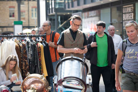 LONDON, UK - August 22, 2017: People shop at Old Spitalfields Market in London. A market existed here for at least 350 yearsのeditorial素材