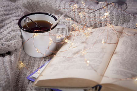 Cup of tea with spoon on white backgroundの写真素材