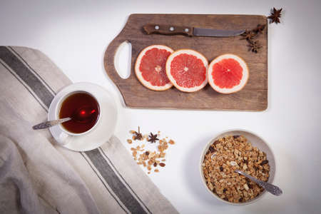Set for mulled wine: sliced grapefruit with anise on the board on the white background.の写真素材