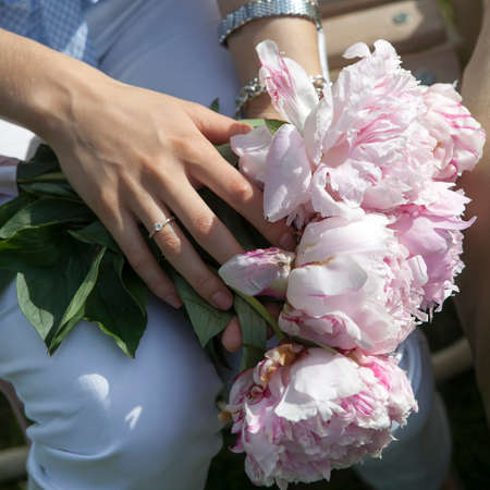 hands of bride and groom with wedding ringsの写真素材