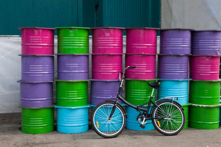 the Bicycle near plenty of colour barrelsの写真素材