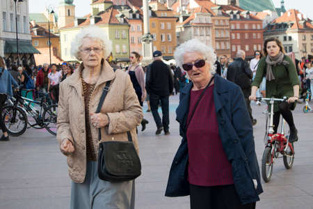 WARSAW, POLAND - April 08, 2018 People on the central street of Warsaw. Eldery ladyのeditorial素材