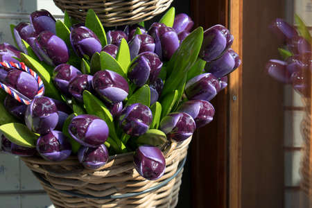 Souvenirs - wooden colorful tulips at Bloemenmarkt - floating flower market on Singel Canal. Amsterdam. Netherlandsの写真素材