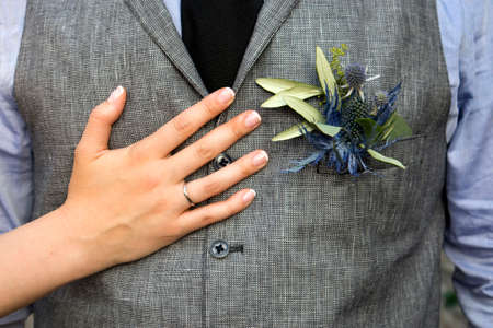 the Boutonniere in the pocket of the suits of the groom of eucalyptus and Eryngium