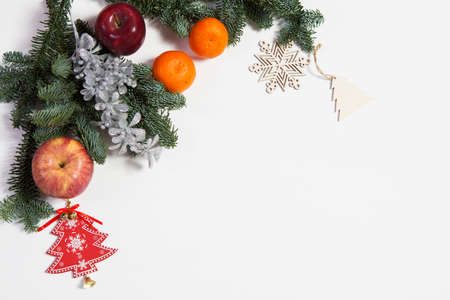 Branches of a Christmas tree with dry oranges and New Year's toys. Christmas cardの写真素材