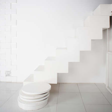 the white staircase against a white wallの写真素材