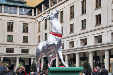 LONDON, ENGLAND - December 21, 2018 Silver reindeer decoration on display at Covent Garden in front of the market building in central London, during Christmasのeditorial素材