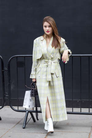 LONDON, ENGLAND - August 11 2018 Girl with long hair in a light dress posingのeditorial素材