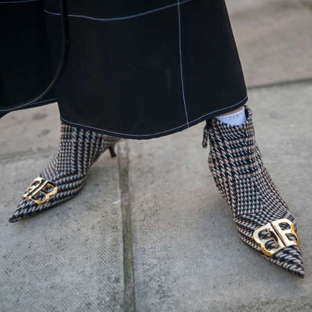 LONDON - FEBRUARY 15, 2019: Stylish attendees gathering outside 180 The Strand for London Fashion Week. Fragment of legs with women shoes BALENCIAGA BBのeditorial素材