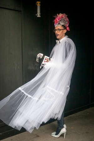 LONDON - FEBRUARY 17, 2019: Stylish attendees gathering outside 180 The Strand for London Fashion Week.のeditorial素材