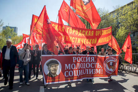 Moscow, RUSSIA - MAY 1, 2019: Moscow's Labor Day Parade. A poster with a portrait of Lenin: Russia,...