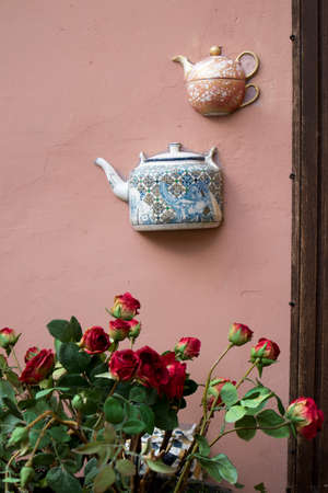 half ceramic teapots glued on the wall of a house in Vilniusのeditorial素材