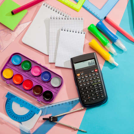 Preparation and learning of primary school children. Bright and multicolored school background with stationery accessories for the study of general subjects. Flat Lay, Copy space, place for text.の写真素材