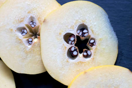 Sliced ripe quince as an ingredient for a meat dish
