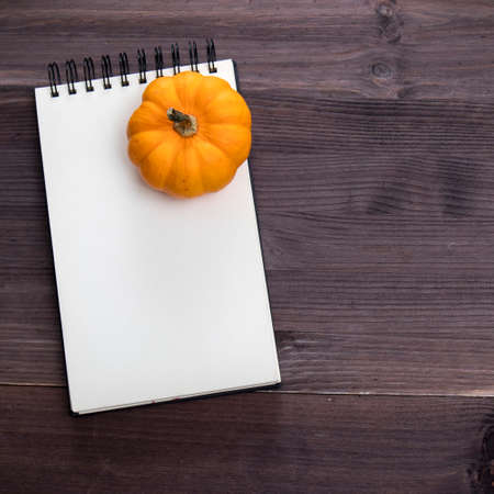 Orange pumpkins , top view on the brown wooden background , web banner with copy spaceの写真素材