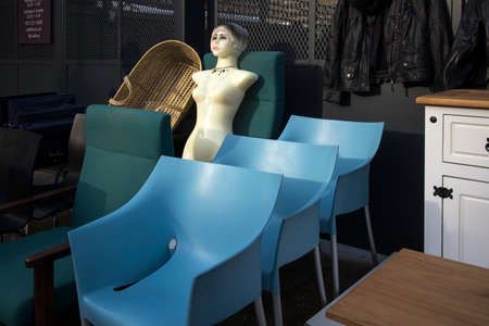 LONDON - December 20, 2020, A mannequin stands on the street near a store with antique things.のeditorial素材