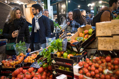 London, UK - 15 March 2020, People shop at Borough Market in Southwark, London. It is one of oldest...