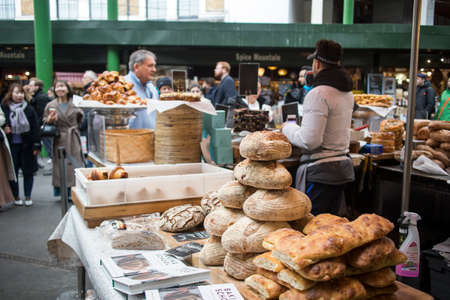 London, UK - 12 March 2020 Selling bread at Borough Marketのeditorial素材