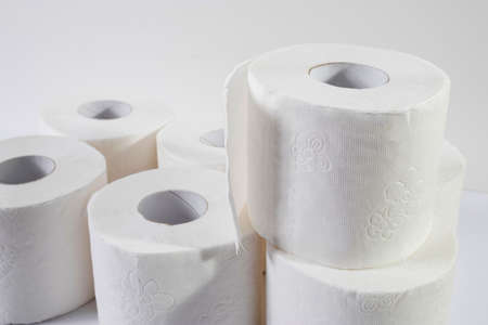 White toilet paper rolls on the gray background. Hygiene concept.の写真素材