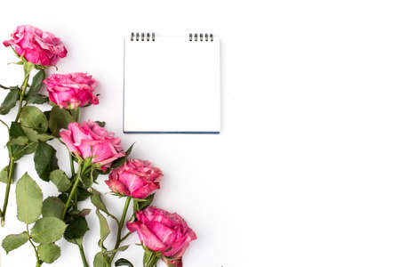 a bouquet of red roses with a diary. Circle. Copy space