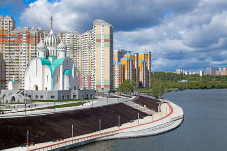 MOSCOW, RUSSIA - May 16, 2020: Construction of Moscow river embankment and St. Nicholas Church in new area of Pavshinsky floodplainのeditorial素材