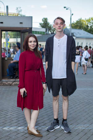 Moscow, Russia - 26.06.2020, Girl in a red dress. Man in a white T-shirt, black cardigan and short shorts. The film director, Kirill Serebrennikov, was convicted of embezzling government grantのeditorial素材