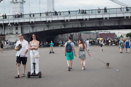 Moscow, Russia - 06 July 2020, A young couple leaned against the building. Young blond man in a gray t-shirtのeditorial素材