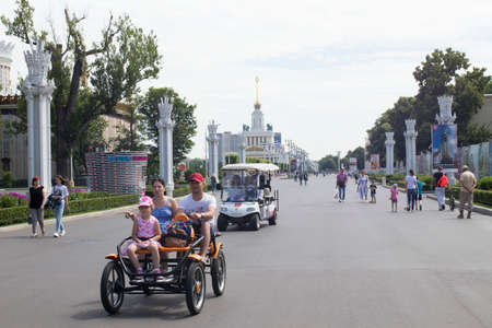 Moscow, Russia - 06 July 2020, A young couple leaned against the building. Young blond man in a gray t-shirtのeditorial素材