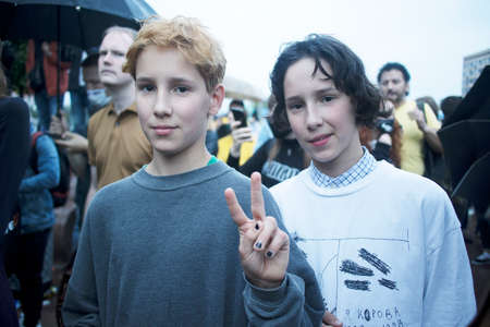 Moscow, Russia - July 15, 2020, Unauthorized rally against results of 2020 Russian constitutional referendum at Pushkinskaya square. Young twins brother against Putinのeditorial素材