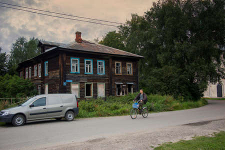 PERESLAVL-ZALESSKY, RUSSIA - July 18, 2020: Ornamental carved windows, frames on vintage wooden rural house. Russian traditional national folk style in architecture. Countryside. Abandoned housesのeditorial素材