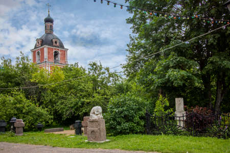 Pereslavl-Zalessky, Russia, - 20 July 2020, Goritsky assumption monastery. The Museum complex. Marble sculpture on the grave - hunched female figure prayingのeditorial素材