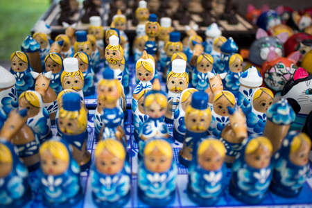 UGLICH, Russia, - 26 July 2020, Counters with the Russian national souvenirs at a fair of folk art. Typical handmade dolls made of cloth at a craft market stall in the Pobedy Parkのeditorial素材