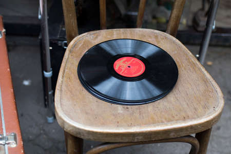 Moscow, Russia - 14 September 2020, Izmailovsky antique market. Old things for sale. Records lie on an old Viennese chairのeditorial素材
