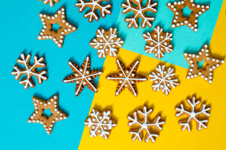 Top above high angle closeup overhead view photo of nice beautiful christmas decoration lying on yellow and blue craft paperの写真素材