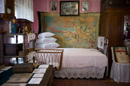 Brateevo, Vologda region - 20 July 2020, interior of traditional Russian hut. bed with pillows,...