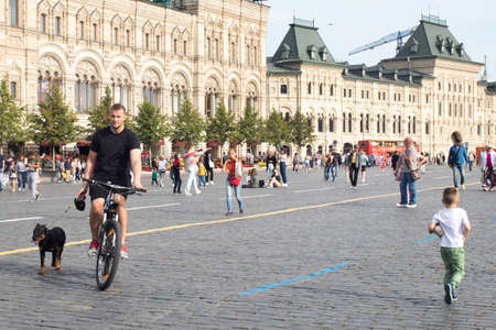 Moscow, Russia - 20 September, 2020, People are photographed on Red Square against the background of...