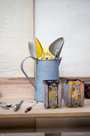 Liverpool Street, London, UK, - 21 September 2020, Spitalfields Antique Market. Zinc pitcher with shoe inserts and lights on the counterのeditorial素材