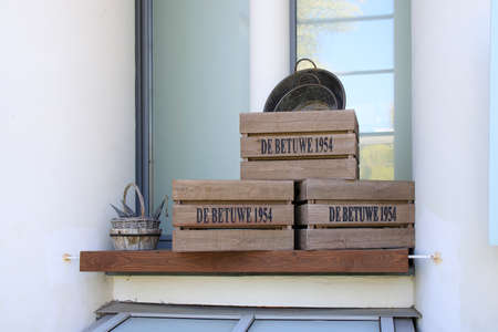 Moscow, Russia - 08 May, 2021, Wooden boxes stacked one on top of another, tin basins, old wicker...