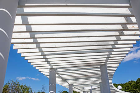 Light and shadow concept, The sunlight shines through the white wooden awning on the wall, Abstract...