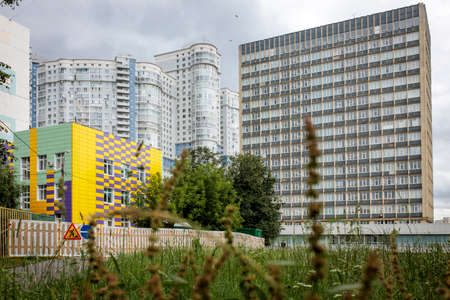 Moscow, Russia - 10 July 2021, Modern residential buildings and a kindergarten in the South-West metro areaのeditorial素材