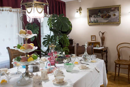 BOGORODITSK, TULA OBLAST, RUSSIA - JUNE 25 2021. The count Bobrinsky palace in Bogoroditsk city. Interior with table and utensils on itのeditorial素材