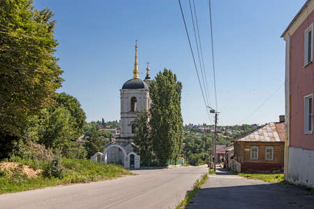 Yelets, Lipetsk region, Russia - July 2021, The old wooden house. A street with old merchant houses and a ruined churchのeditorial素材